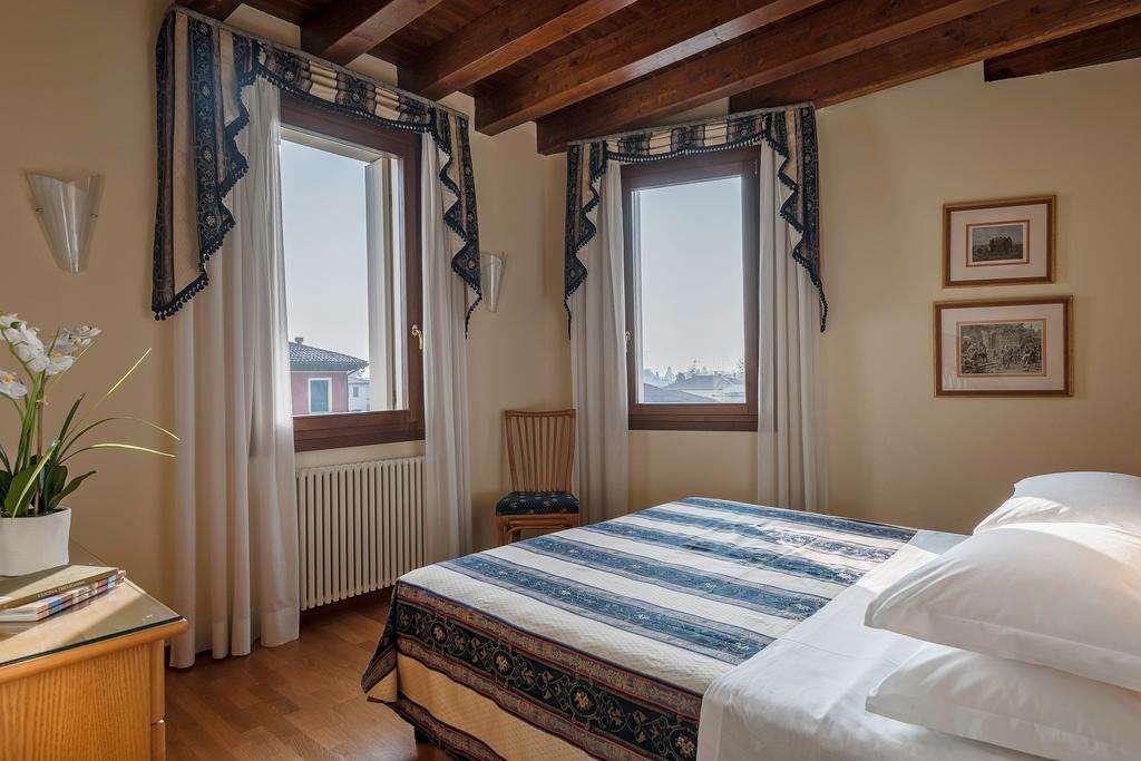 Palazzo Brando - Living Apartments تريفيزو الغرفة الصورة